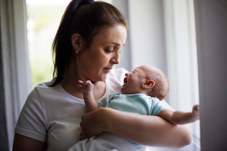 Mother and crying newborn baby